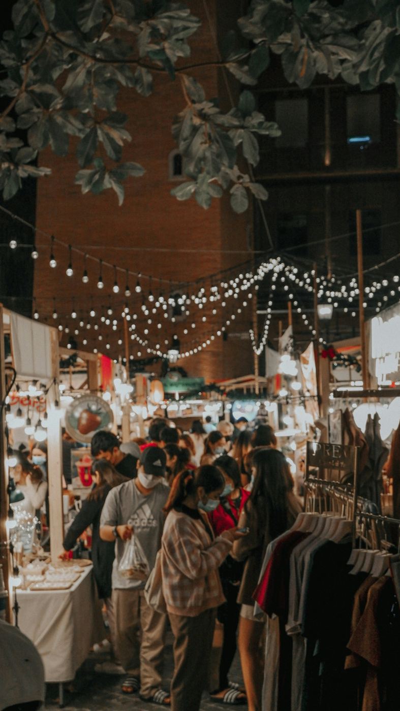 A busy Chiang Mai night market under strings of lights
