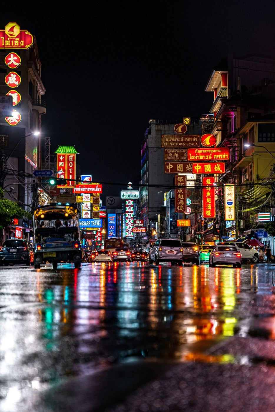 Neon signs and traffic on Yaowarat Road in Bangkok's Chinatown at night